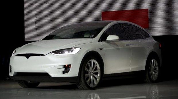Tesla delivers Model X electric SUV to take on luxury carmakers