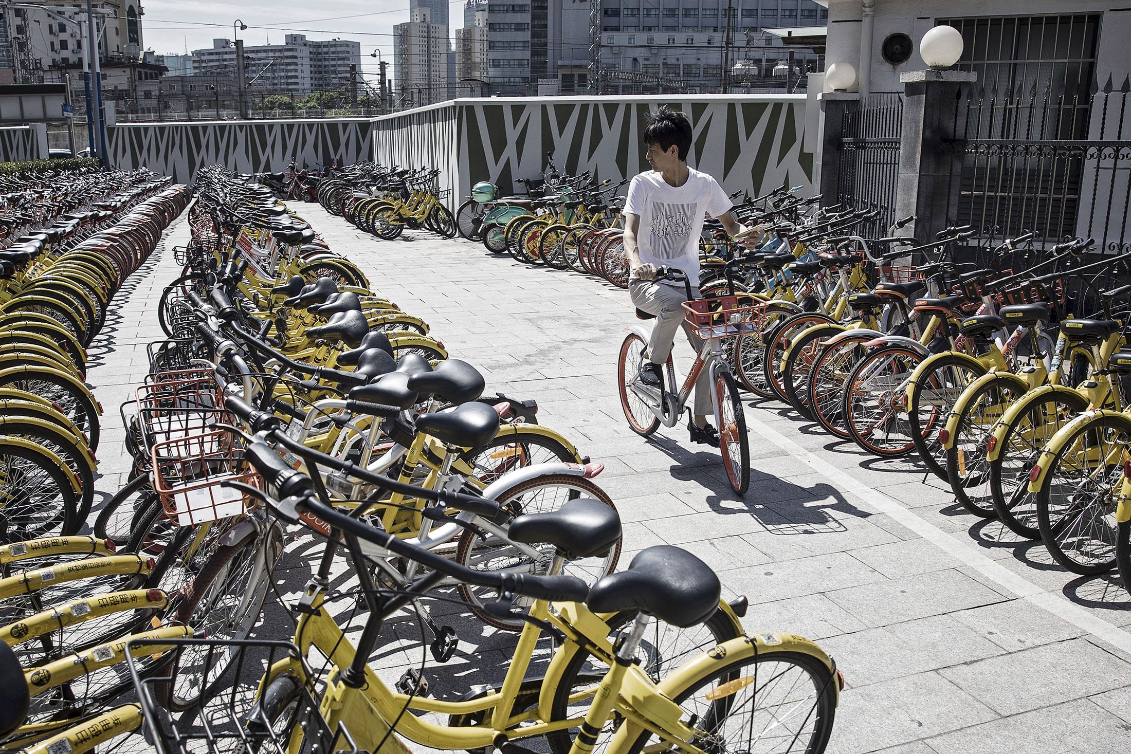 Bike sharing companies revisit docking options to avoid clutter in Japan