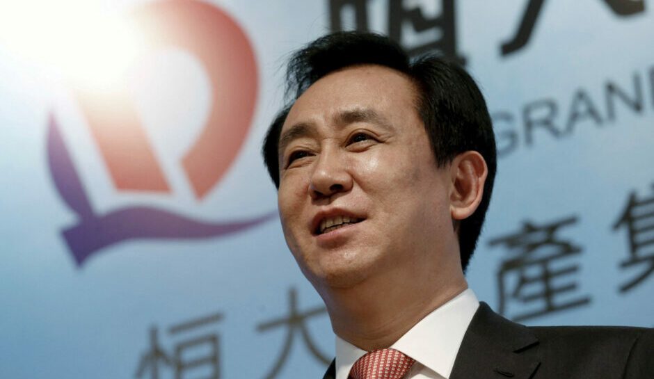 Evergrande's billionaire boss goes from power circles to police surveillance