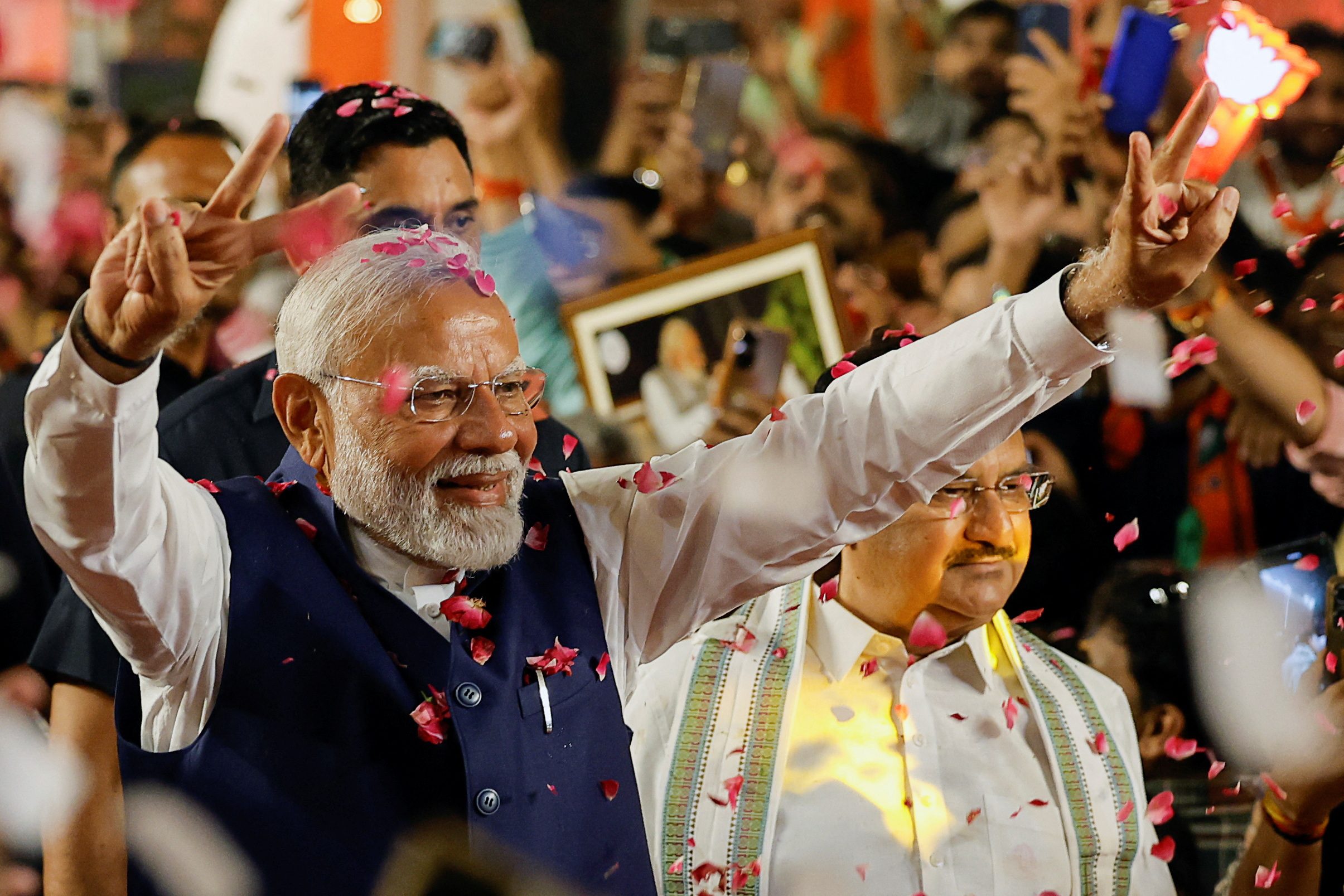 India elections: Modi's party scrapes through with help of allies but loses majority