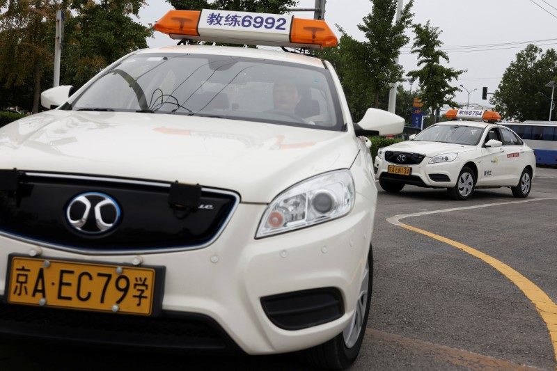 Drivers fret as China's robotaxis pick up pace and passengers