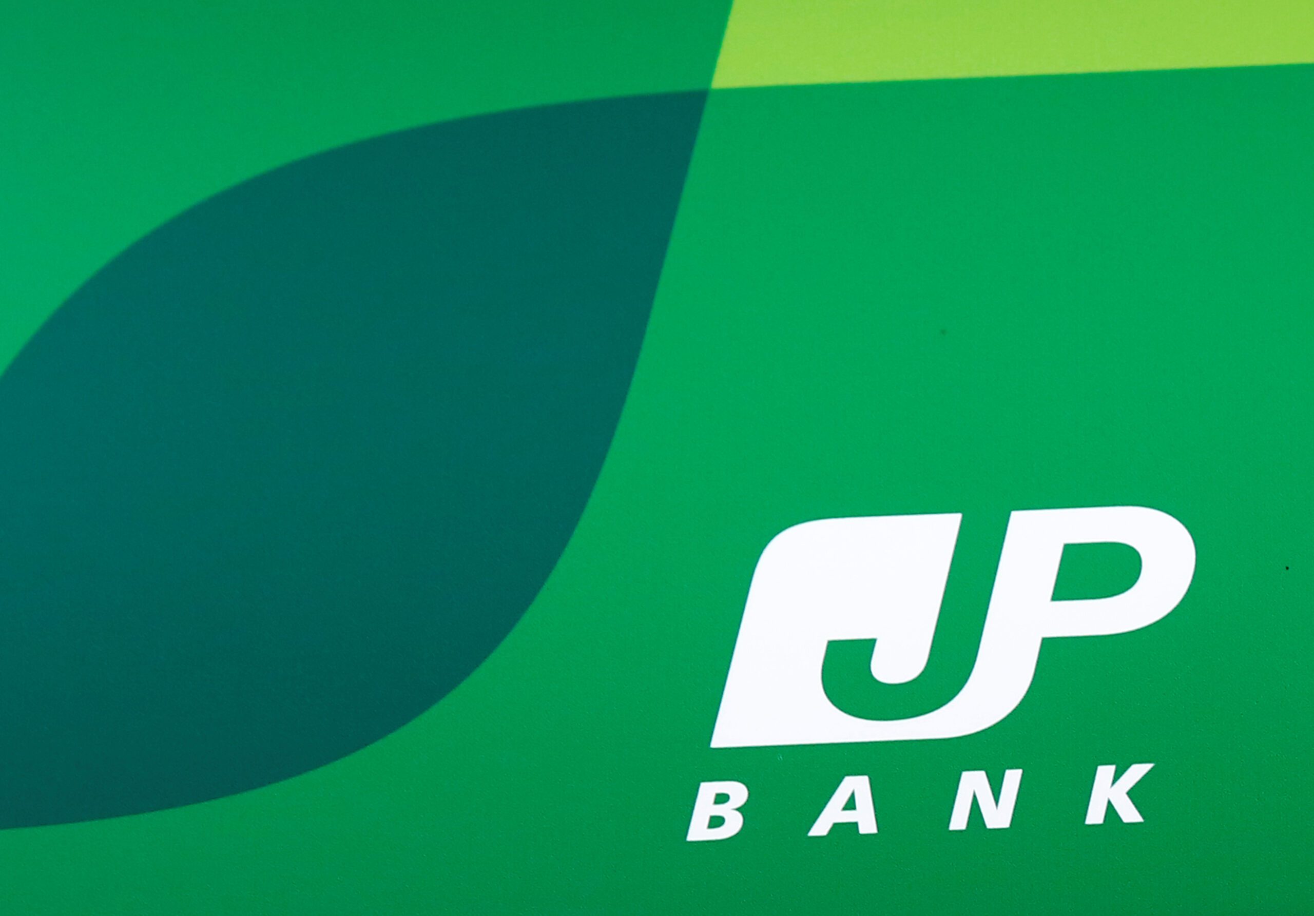 Japan Post planning $4b sale of shares in Japan Post Bank: report