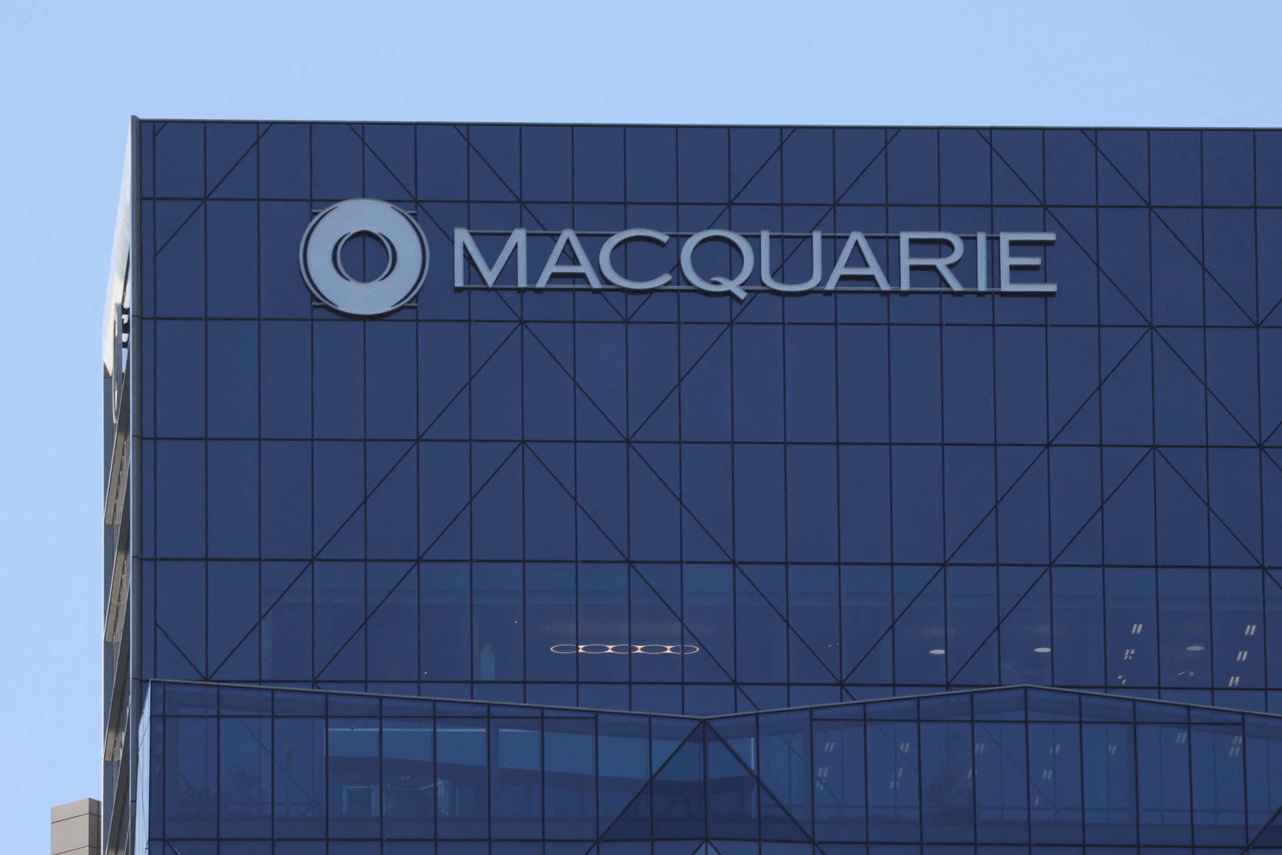 Japan's Nomura to buy Macquarie's US, European asset management units for $1.8b