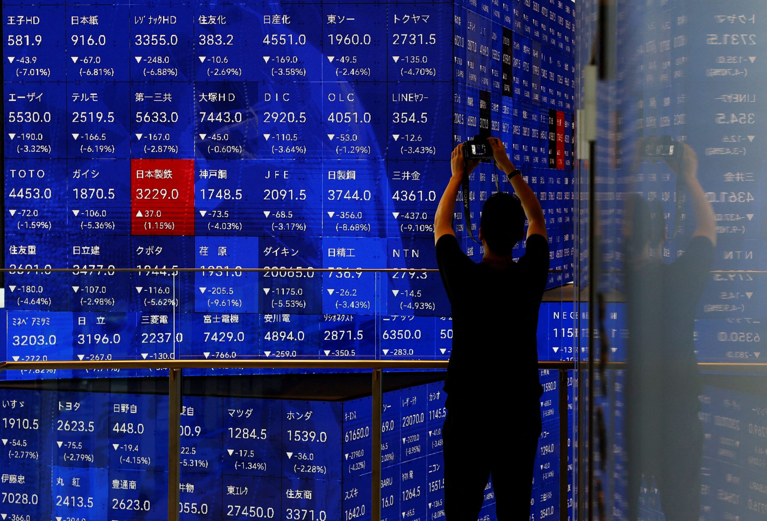 Japan's Nikkei scales record high, SoftBank leads tech surge